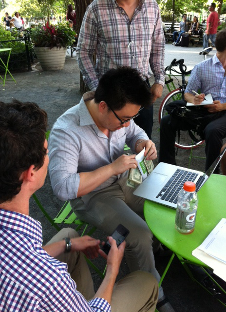 Transaction in action: an in-person bitcoin exchange is made in Union Square at a July Satoshi Square event.